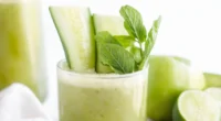 this image shows a glass full of cucumber mint juice